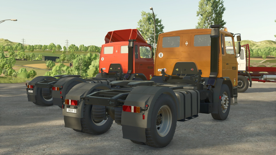 FS25 mods Renault G210 semi v1.0.0.0 with orange and red truck cabs parked on road in Farming Simulator 25.