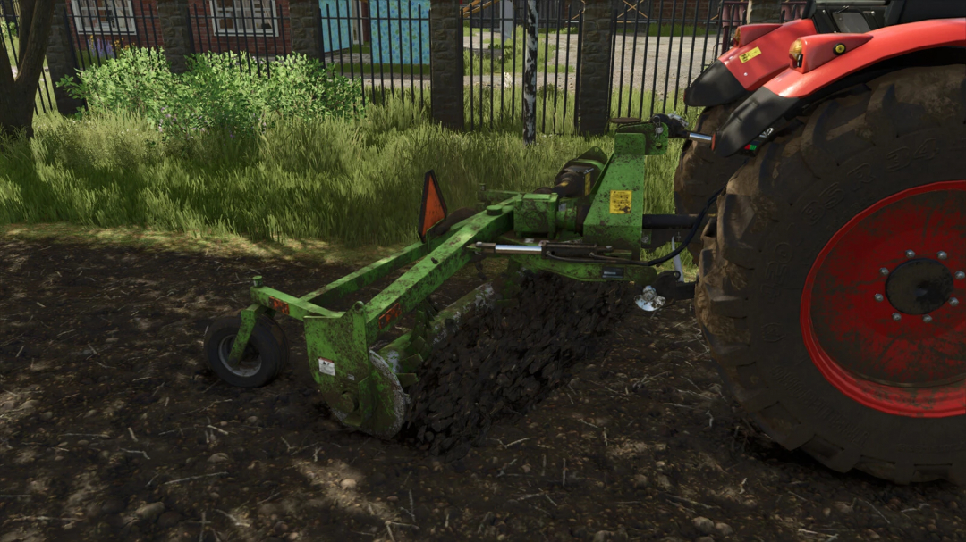 SRW 800 Stone Windrower in FS25 mod, attached to a red tractor, stirring soil in a farm setting.