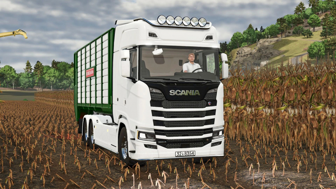 White Scania S Hooklift truck mod in FS25, driving through a field. Farming Simulator 25 mods enhance gameplay realism.