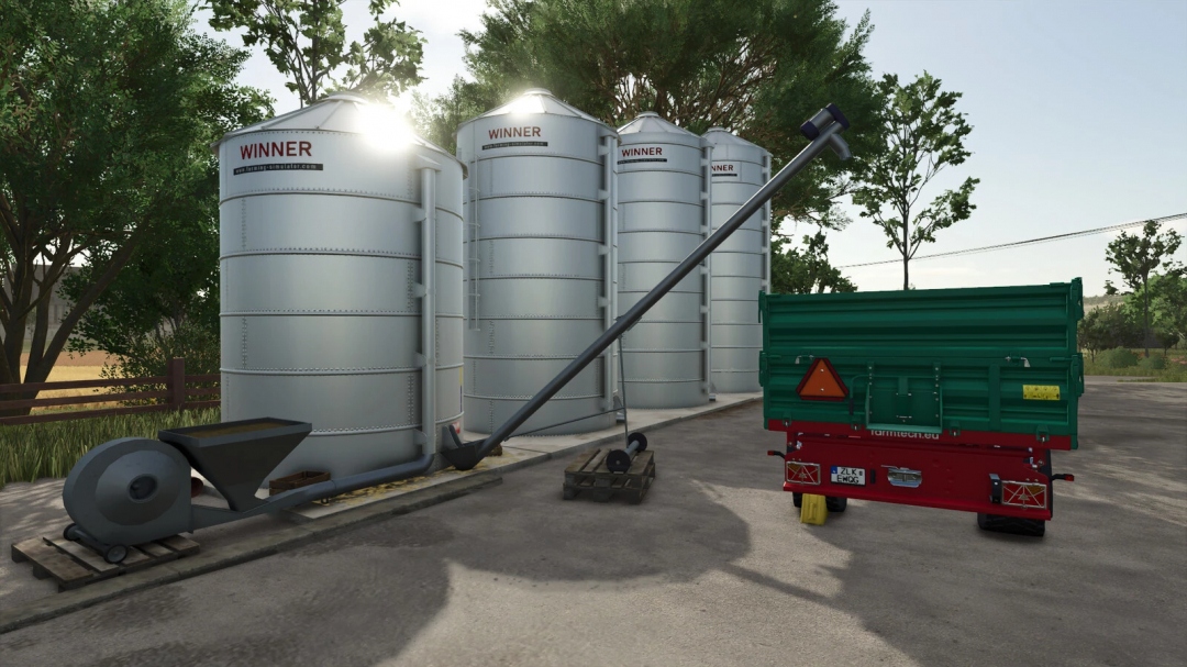 FS25 mods, Small New Silos in Farming Simulator 25 with equipment and trees in background.