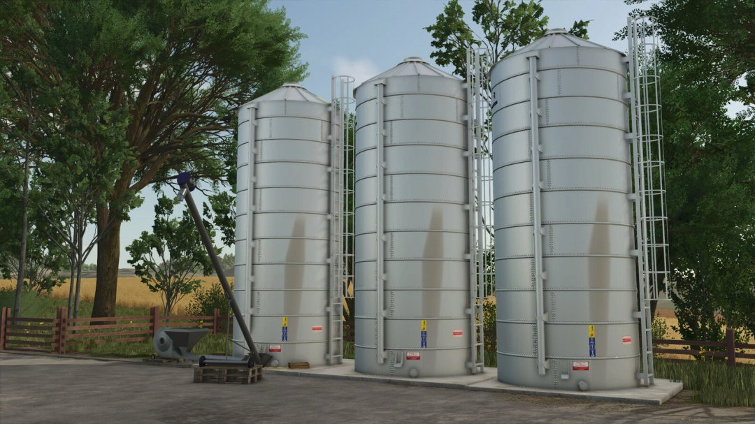 Small New Silos mod in FS25, showcasing three vertical silos among trees.