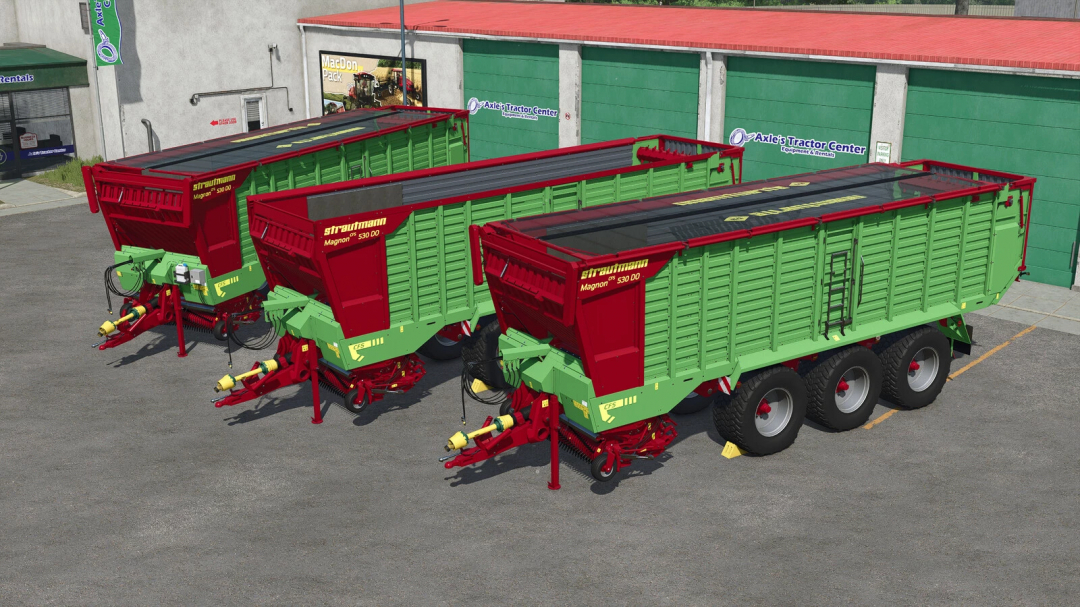 Three Strautmann Magnon 530 trailers in FS25 mod, showcasing vibrant red and green design at a tractor center yard.