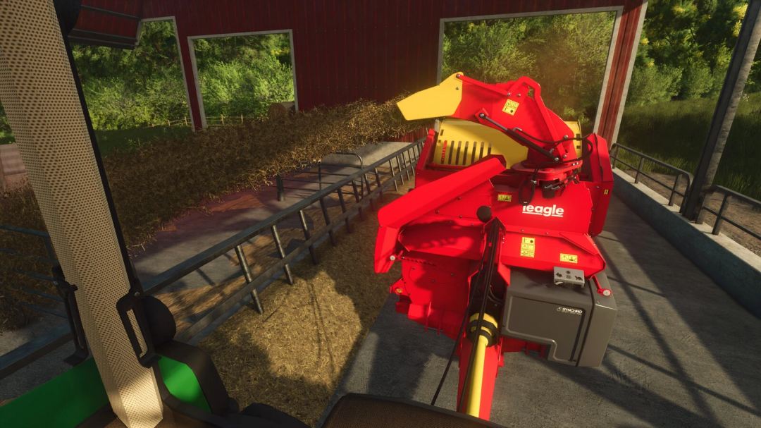 FS25 mod Teagle Tomahawk 8250 in use within a barn, dispersing feed on the farm.