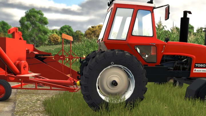 fs25-mods, Allis Chalmer 7000 Series tractor mod in FS25, featuring a red tractor with rear linkage in a grassy field.