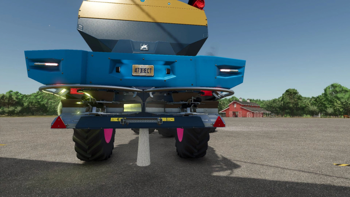 fs25-mods, Rear view of Amazone spreader mod in FS25 with blue and yellow design, spreading material on farm.