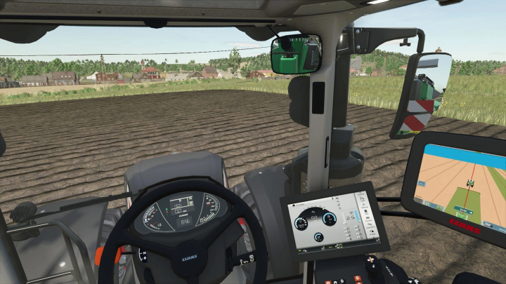 fs25-mods,  Interior of the Claas Axion 960 TT mod in FS25 showing control panels and field view.