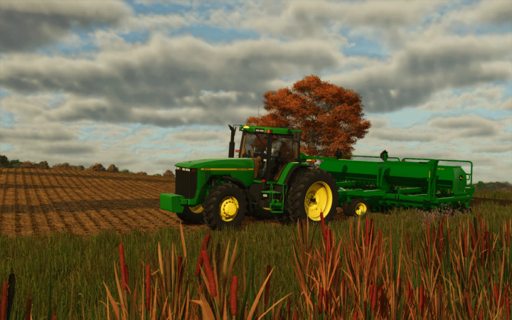 fs25-mods,  FS25 mod showcasing John Deere 1590 Drill v1.0.0.0 in a field with autumn trees, enhancing Farming Simulator 25 gameplay.