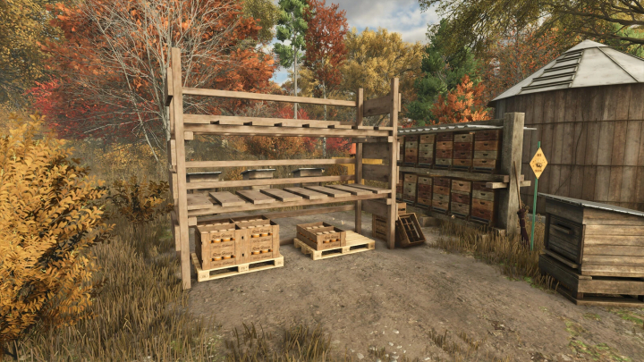 fs25-mods,  Honey Pallet Rack mod for FS25 in a rustic outdoor setting with autumn foliage, featuring wooden shelves for honey storage.