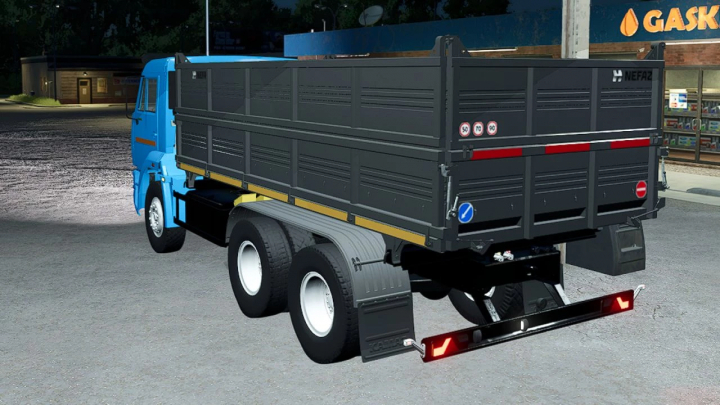 fs25-mods,  FS25 mod Kamaz 45143 v1.0.0.1 truck with blue cab and black container parked at night.