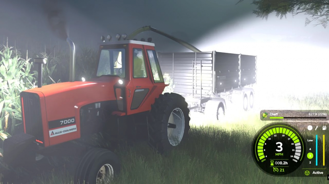 Allis Chalmer 7000 Series tractor mod in FS25 at night with trailer.