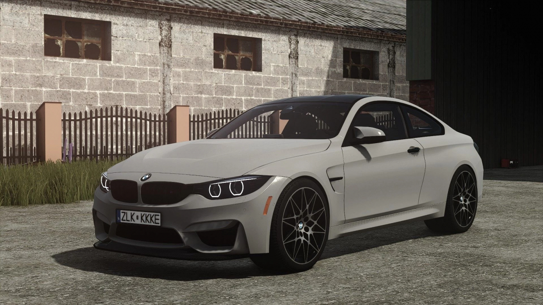 BMW M4 mod parked in front of a barn in Farming Simulator 25. FS25 mods add realistic vehicles.