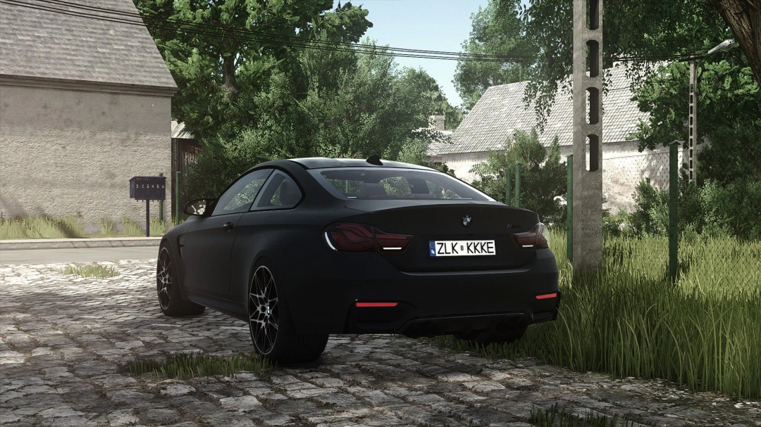 BMW M4 mod for FS25 parked on cobblestone street, surrounded by greenery.