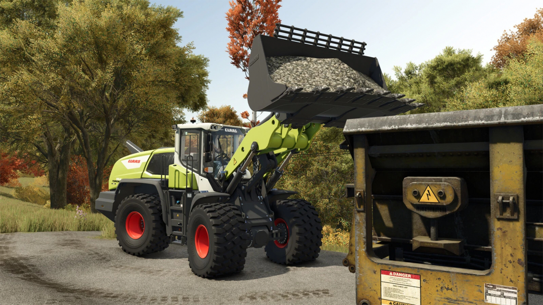 CLAAS TORION 1914 wheel loader mod in FS25 lifting gravel near equipment.