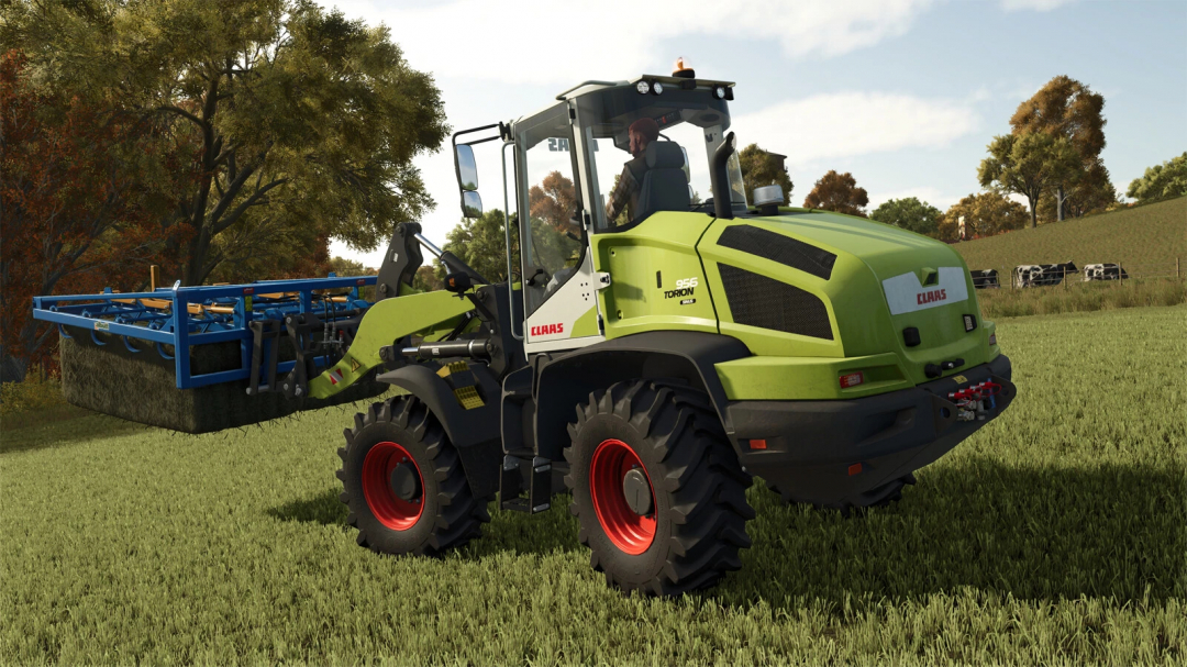 CLAAS TORION 956 SINUS in FS25 mod, wheel loader operating in a grass field.