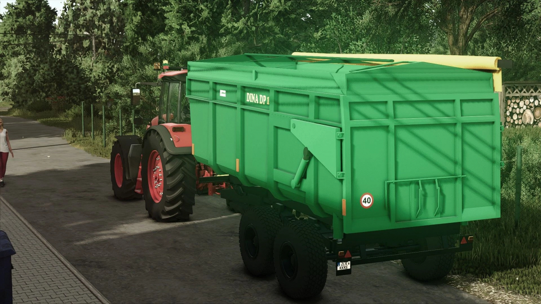 FS25 mod Dinapolis dp 14 attached to a tractor on a road in Farming Simulator 25.