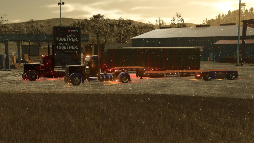 FS25 mod showing a Kalyn Siebert Dropdeck Trailer in a farm setting with glowing lights and falling snow.