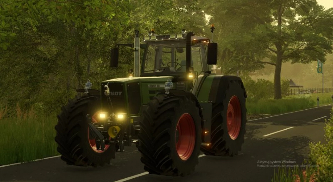 FS22 Fendt 800/900 Favorit EDIT mod showing a detailed tractor on a rural road in Farming Simulator 22.