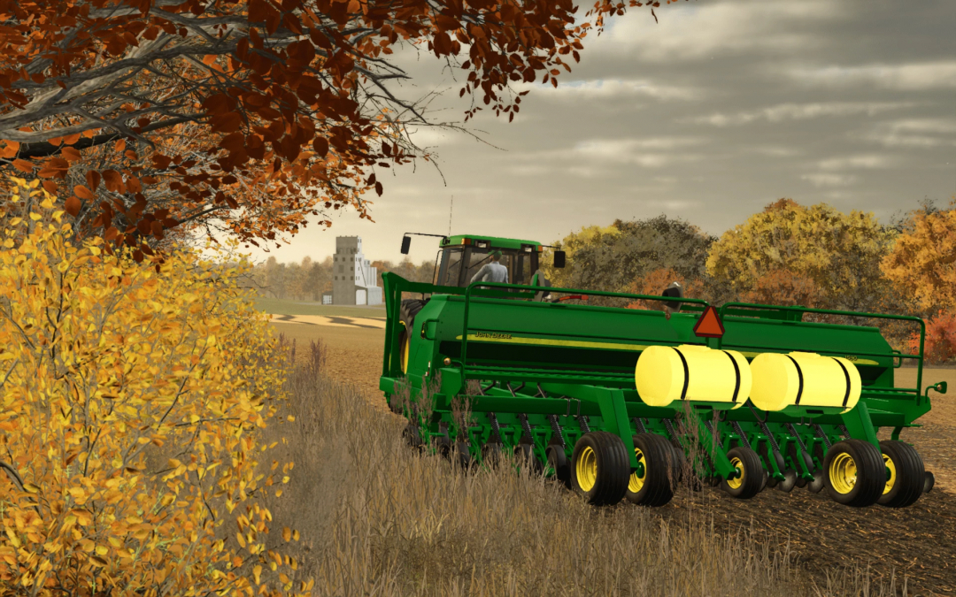 FS25 John Deere 1590 Drill mod in autumn field, surrounded by colorful foliage. Part of Farming Simulator 25 mods.