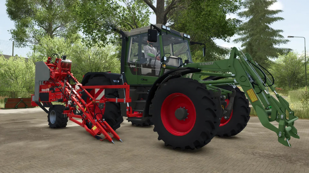 Fendt Implement Carrier Pack mod for Farming Simulator 25 showing a green Fendt tractor with a red implement on a paved area.