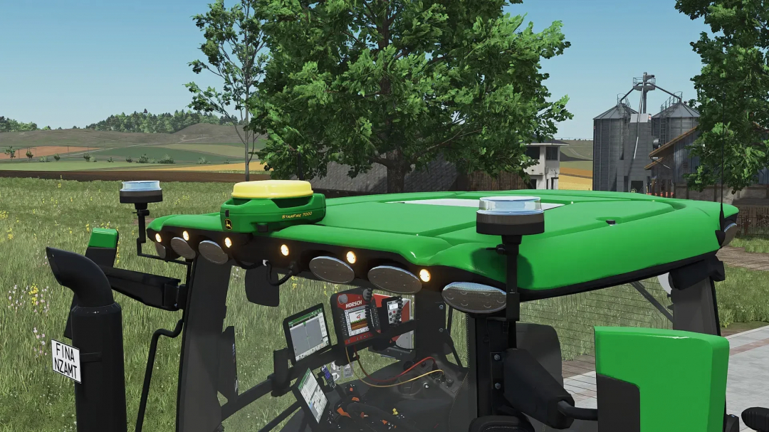 Close-up of John Deere 6R XLarge tractor mod in FS25, featuring a detailed cabin and control system.