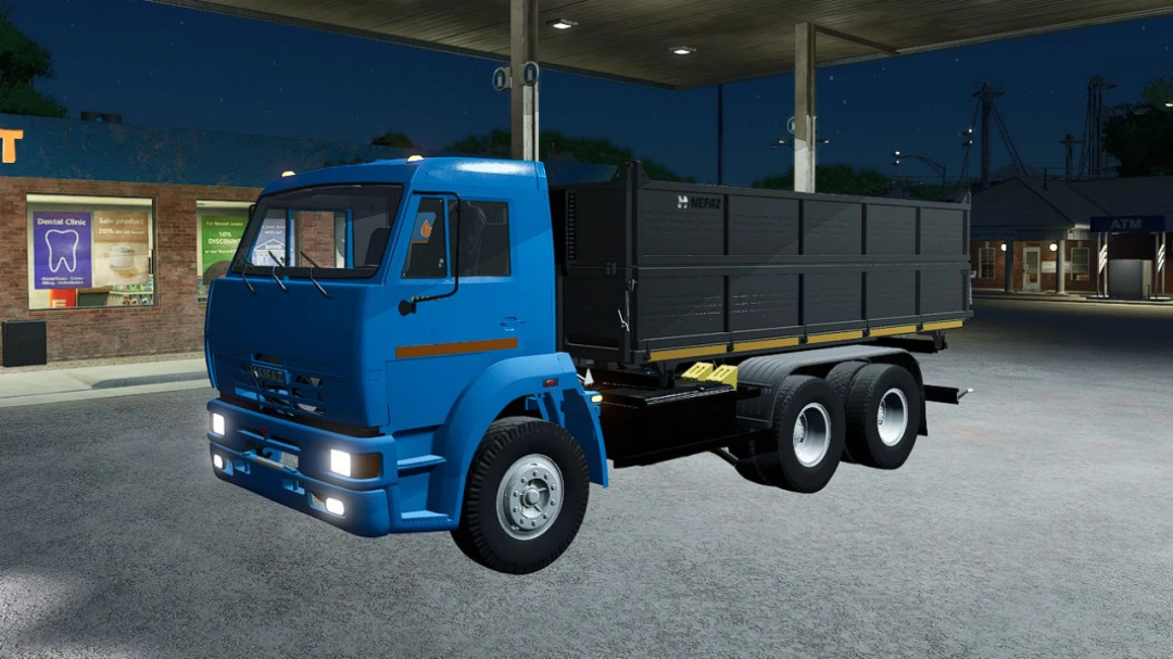 Kamaz 45143 truck mod for Farming Simulator 25, at night in a parking area.