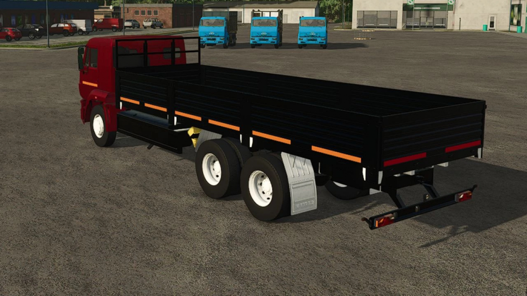 Kamaz 65117 v1.0.0.0 mod for FS25 with a red cab and large black cargo bed in a parking area.