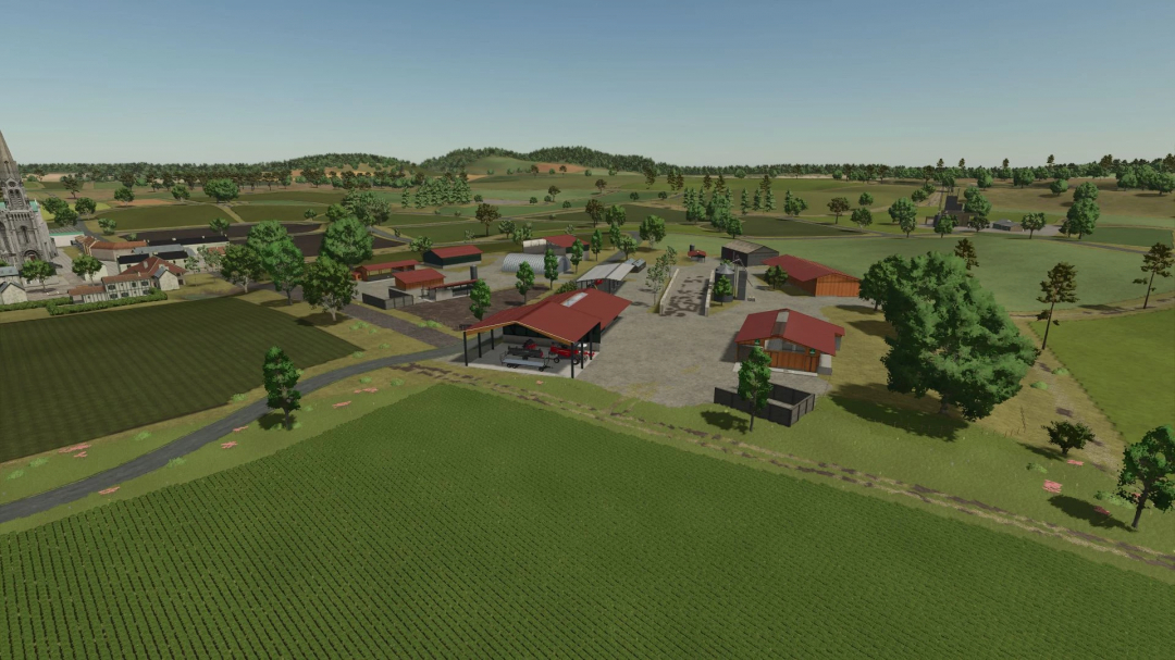 Aerial view of La Ferme de la Vallée Extension in FS25, featuring farm buildings and fields in a rural landscape.