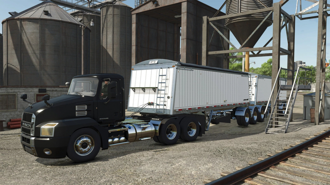 FS25 mod LodeKing Distinction Super-B trailer parked near silos.