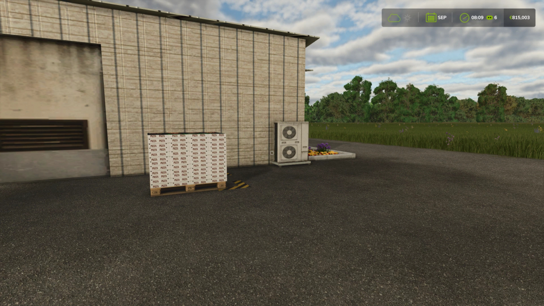 FS25 Pizza Production mod showing a pallet of pizza boxes outside a factory building, with greenery in the background.