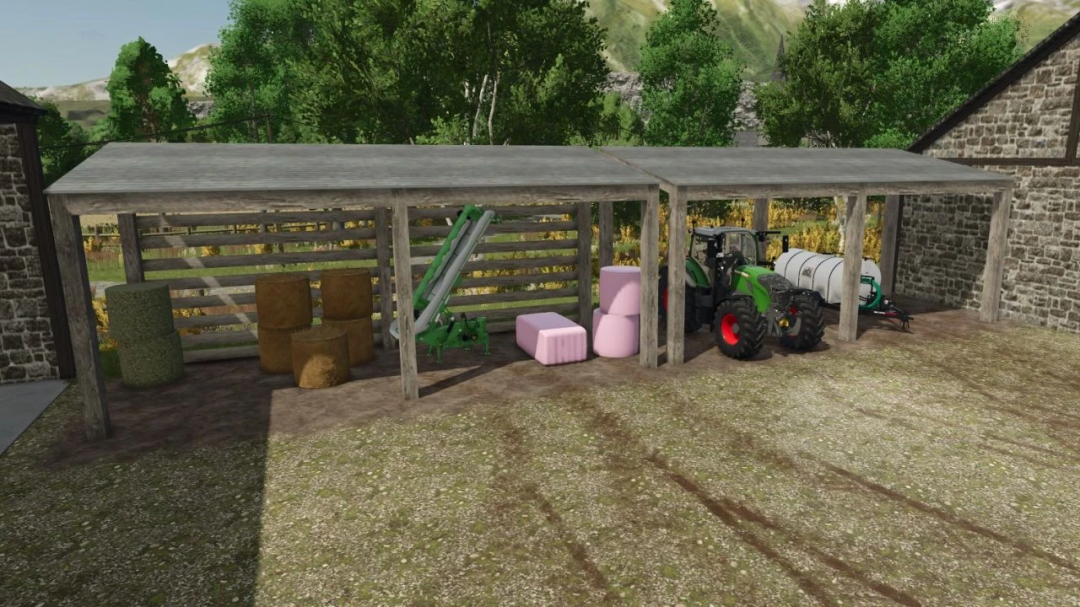 FS25 mod showing a pack of two wooden buildings with stored hay bales, equipment, and a tractor.