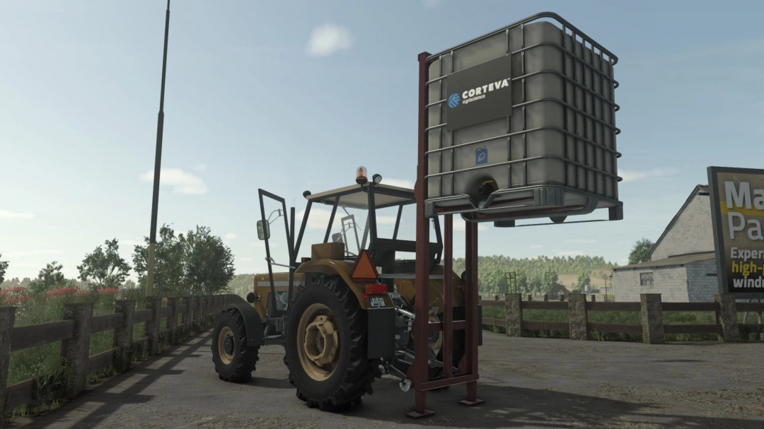 Rear tractor with forklift attachment lifting a large container in FS25 mod 'Rear Tractor Forklift Pack v1.0.0.0'.