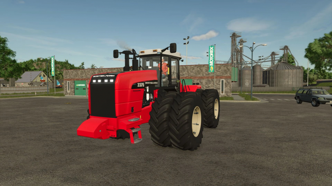 Rostselmash RSM 2375 tractor mod in FS25, parked near industrial background.