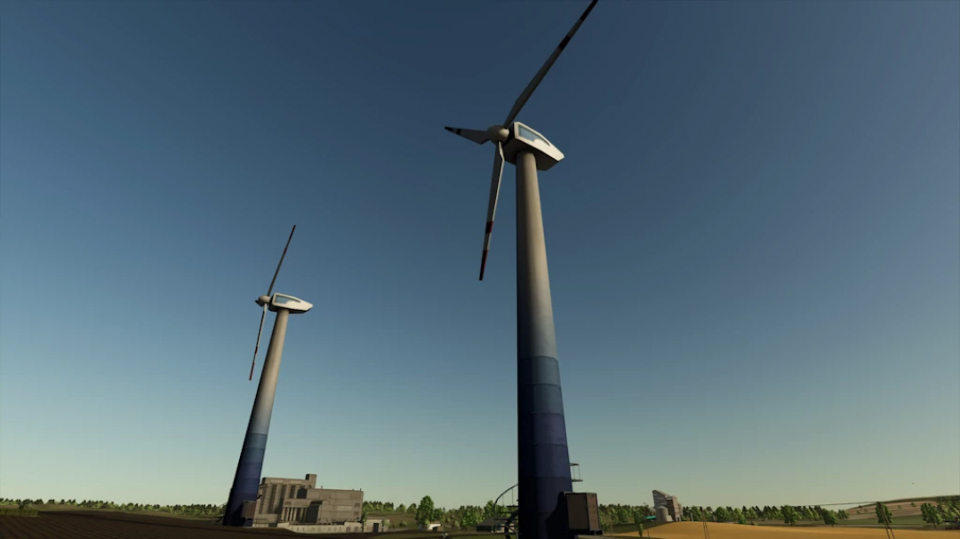 Two large wind turbines in a field, seen in Farming Simulator 25 mod 'Wind Turbine Large 1.2.0.0'.