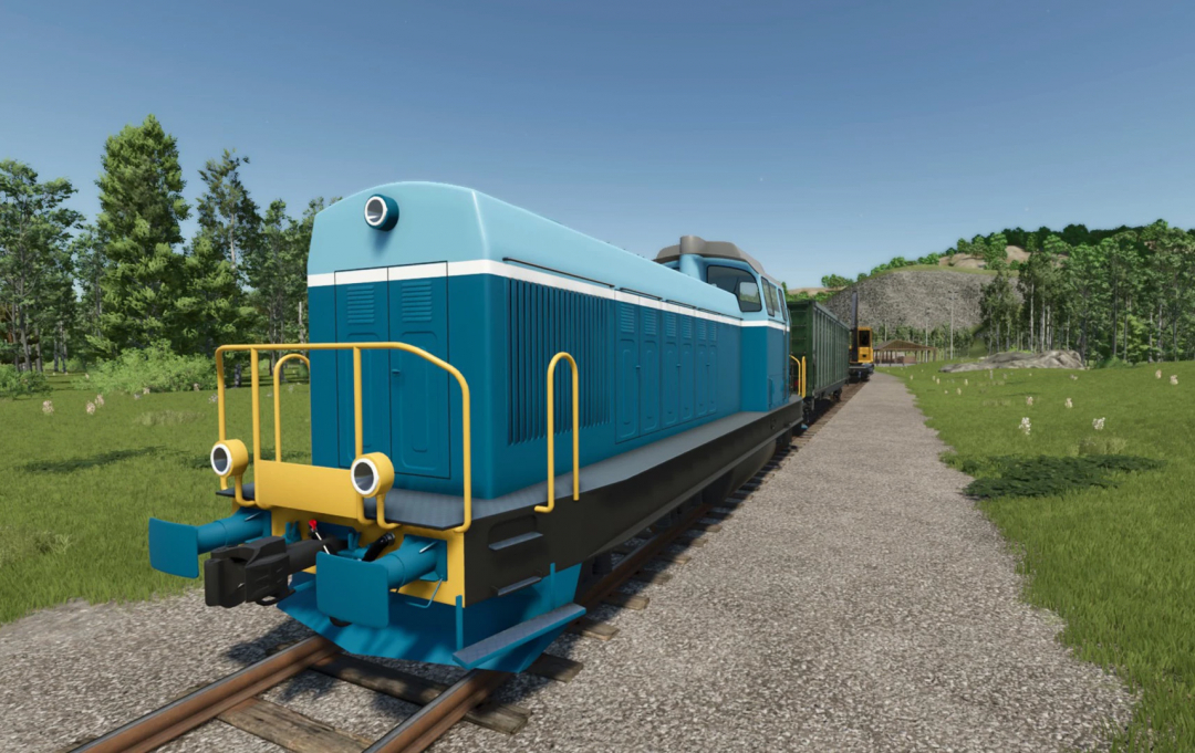 Blue train on tracks in Farming Simulator 25 ZCA Trains mod, showcasing FS25 mods.