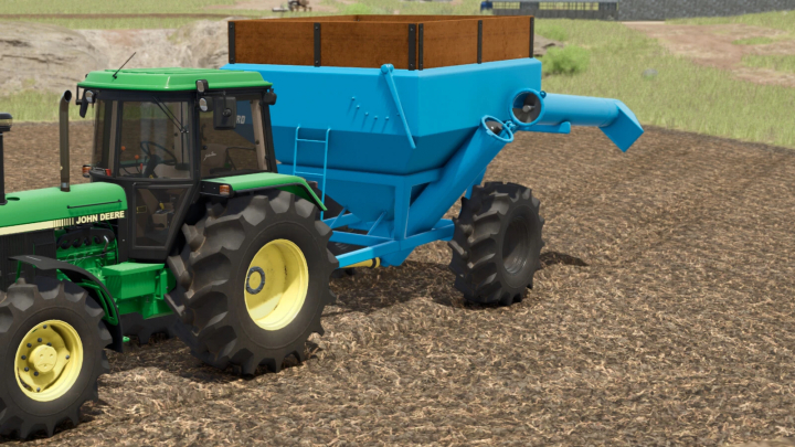 fs25-mods, LIZARD 60 v1.0.0.0 mod in FS25, showing a green tractor with a blue trailer on a farm field.