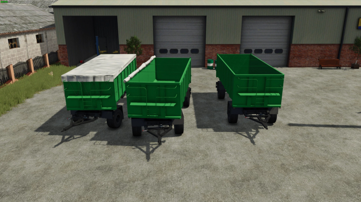 fs25-mods,  FS25 mods: Three green Selfmade Trailer 18t v1.0.0.0 parked outside a garage in Farming Simulator 25.