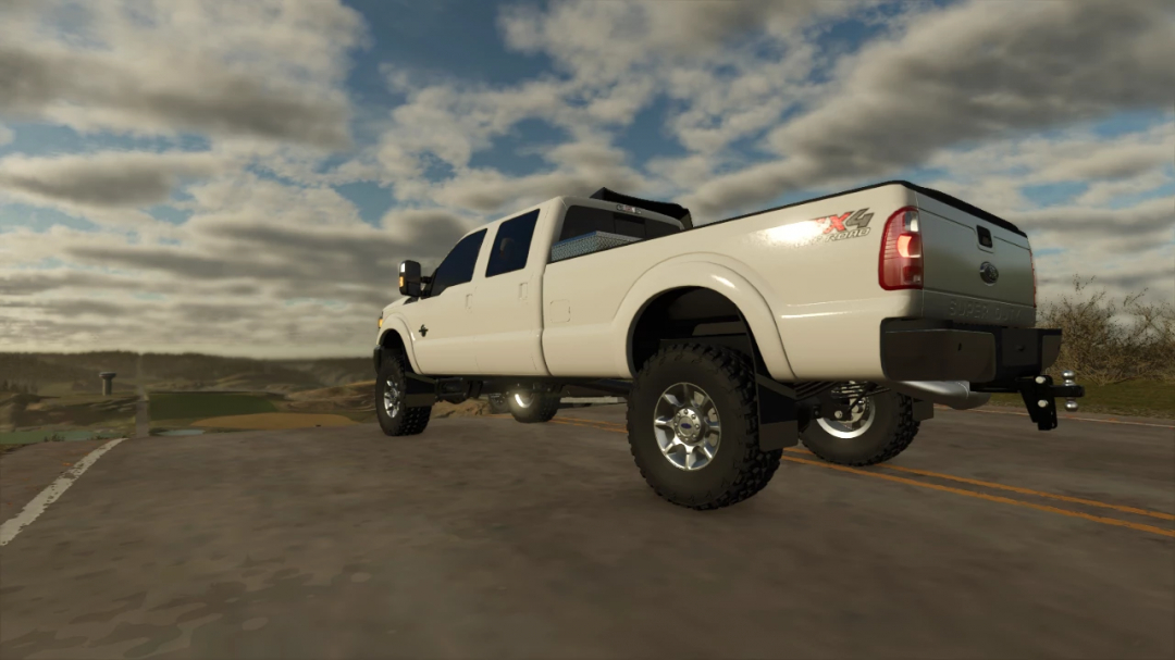 2015 Ford F350 mod for Farming Simulator 25, featuring a white truck with rugged tires on an open road.