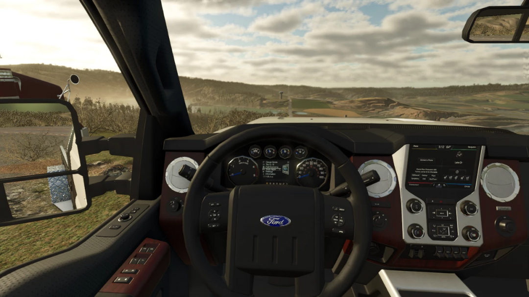 Interior view of 2015 Ford F350 mod in FS25, showcasing dashboard details against a scenic landscape.