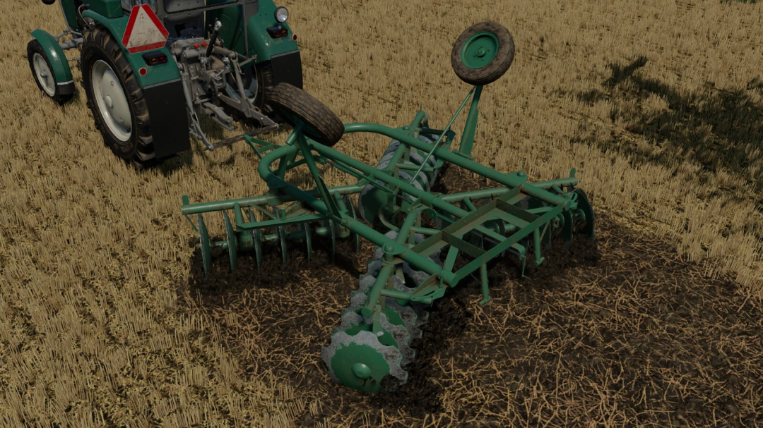 FS22 mod BTc 2,5 / U202/0 Sawa v1.0.0.0 with a green disc harrow attached to a tractor in a field.