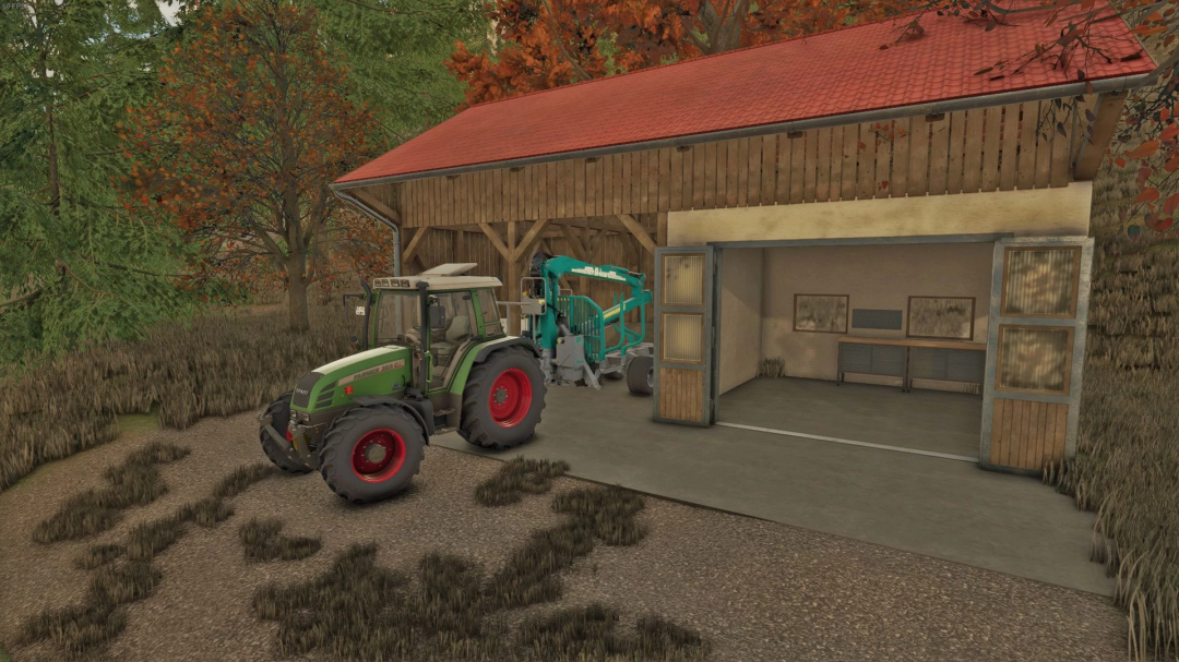 FS25 mod Barn With Workshop showing a tractor next to a wooden barn with open workshop doors.