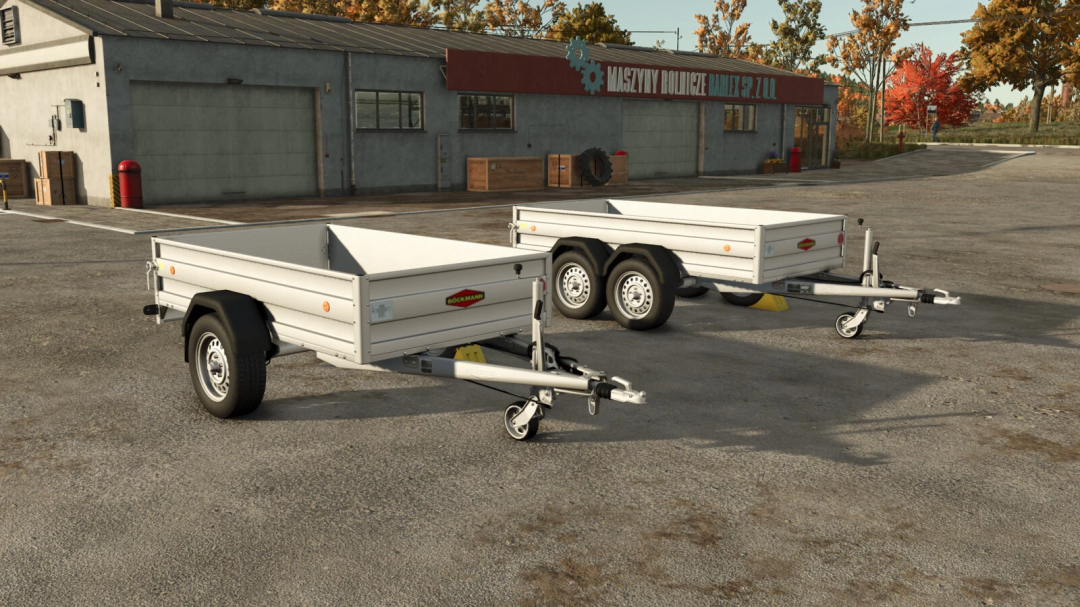 Two Boeckmann trailers in a yard, featured in FS25 mods for Farming Simulator 25.