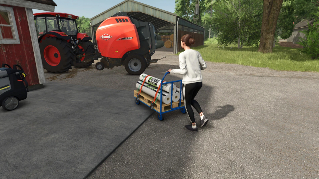 Player using Cargo Cart mod in FS25 to transport farm supplies near a tractor.