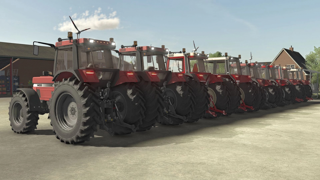 Line of red Case IH 55/56 Series tractors from FS22 mod parked on a farm.