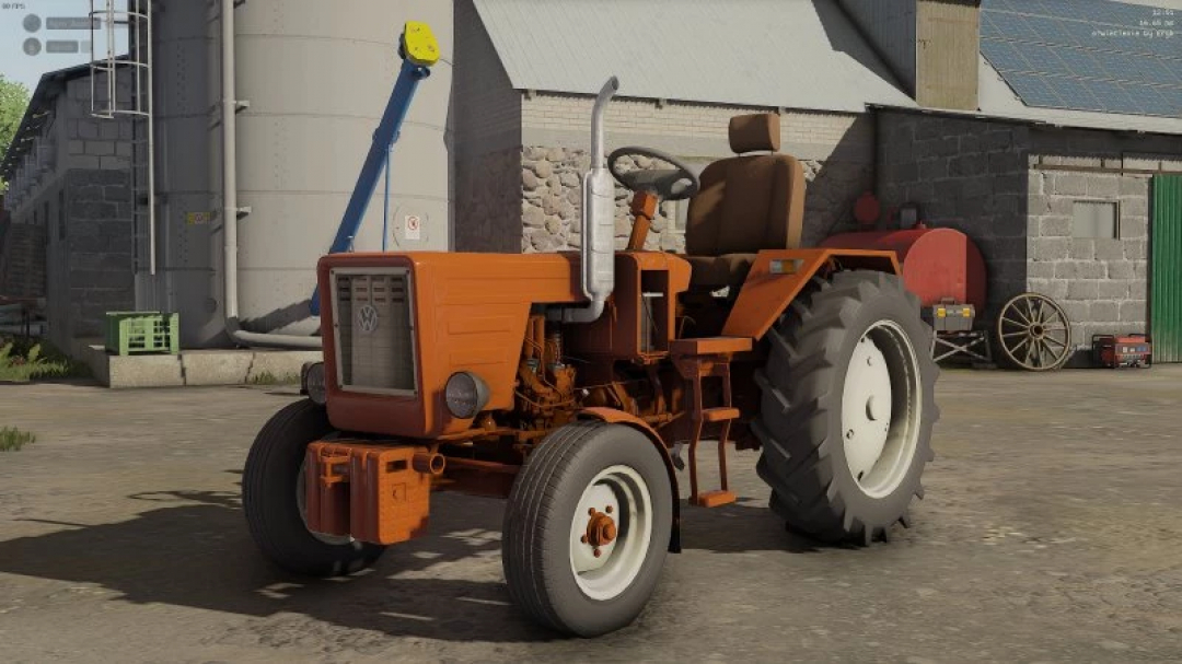 FS22 W?adzio T25 edit mod showcasing an orange vintage tractor in Farming Simulator 22.