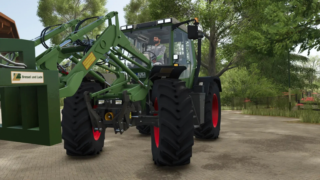 Fendt implement carrier from FS25 mods, showcasing a tractor with red wheels in a rural setting.