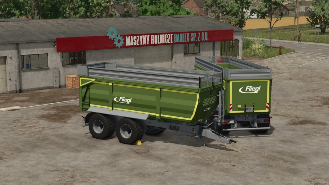 Fliegl TMK273 trailer mod for Farming Simulator 25 parked near farm buildings.