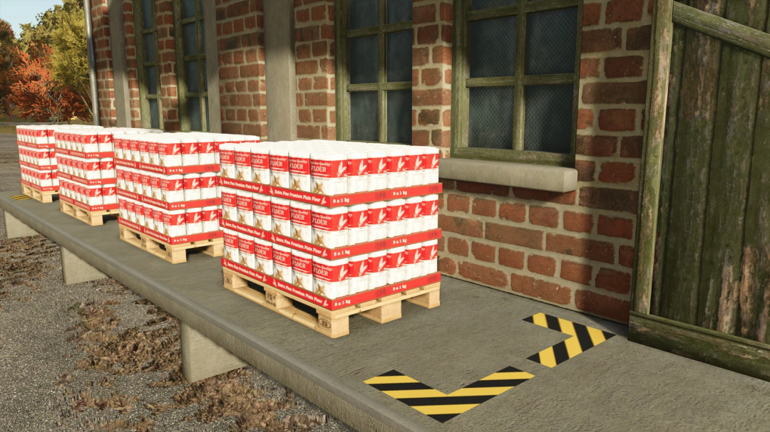 Pallets of flour outside brick building in FS25 Flour Production mod.