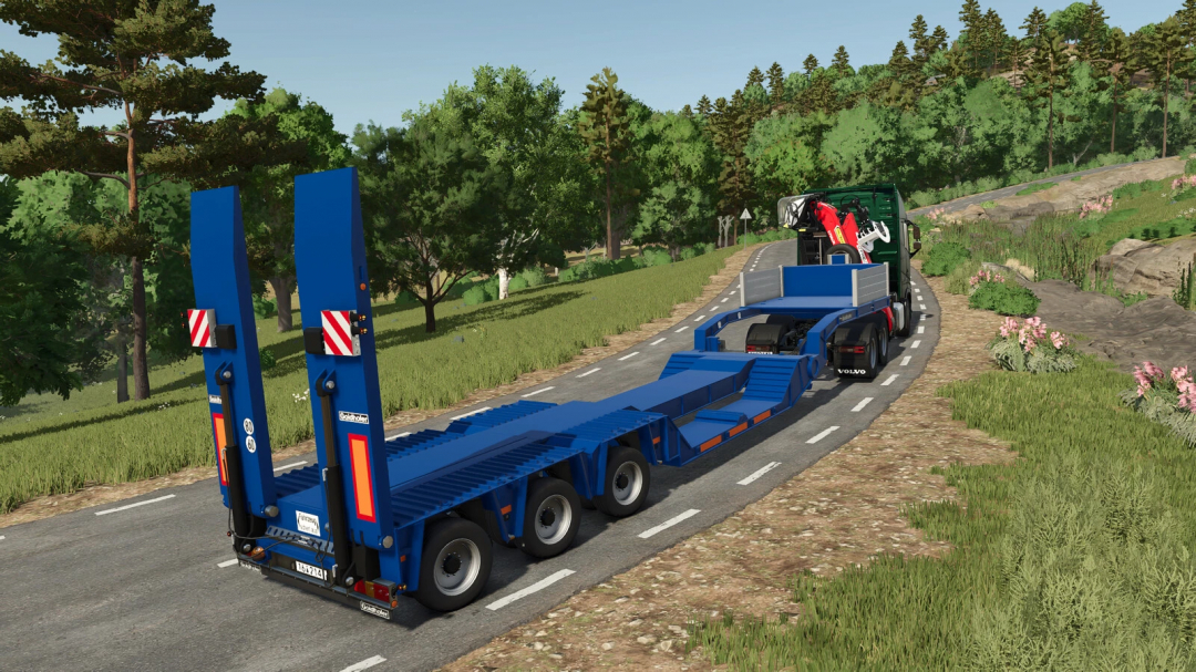 Goldhofer STZ Special Lowloader mod in FS25 on a road surrounded by greenery.