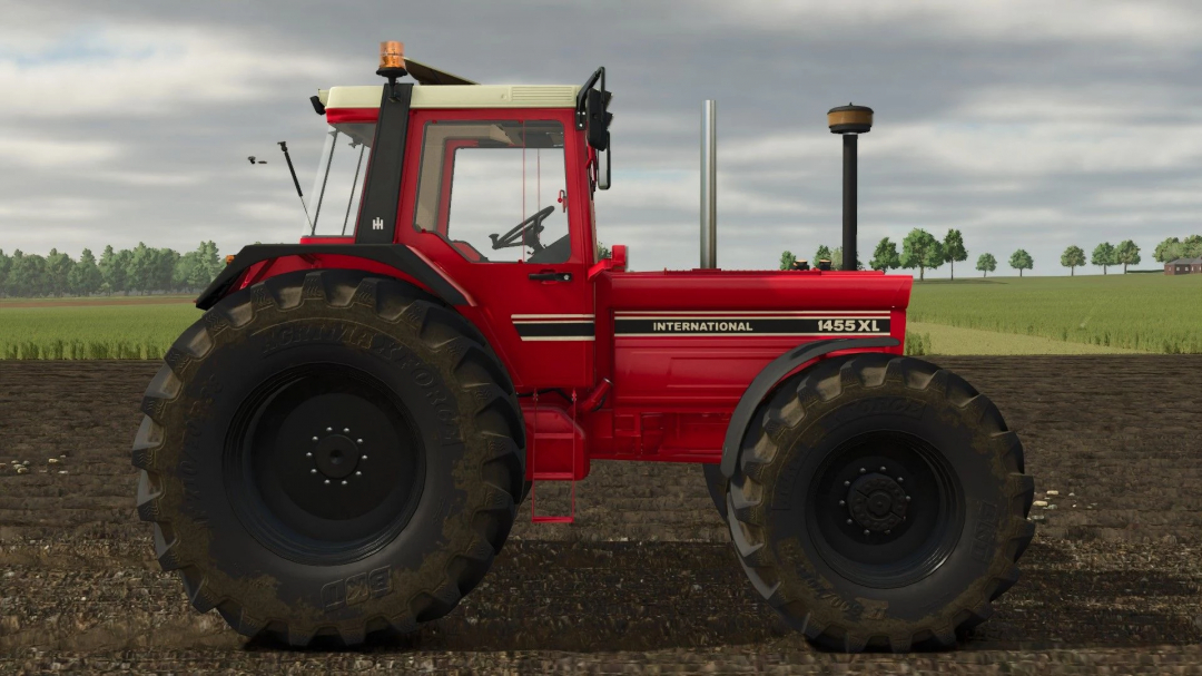 IHC 1255-1455 XL tractor mod for Farming Simulator 25, showcasing a red tractor with large tires in a field. FS25 mods.