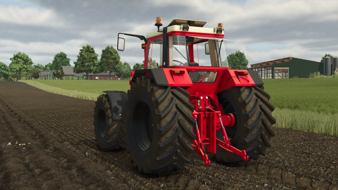 IHC 1255-1455 XL tractor mod in Farming Simulator 25 on a plowed field, featuring realistic detail and farm setting.